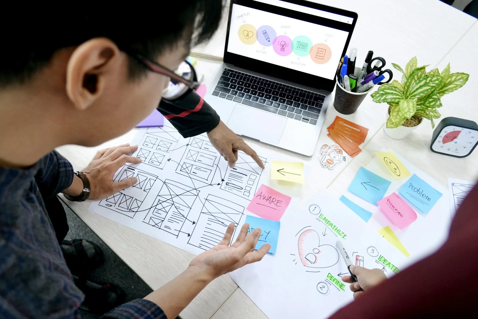 Creative professionals reviewing visual identity and design materials